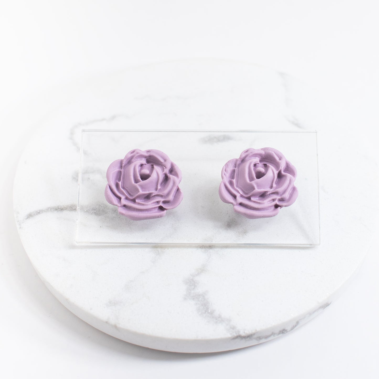 Rosa-nappikorvakorut, eri värejä