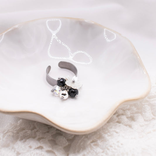 Celine-sormus, musta