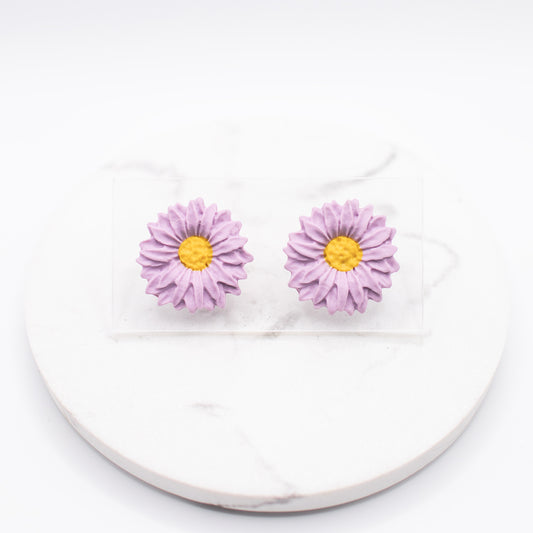 Flora-nappikorvakorut, eri värejä